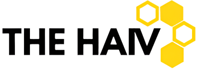 Logo of 'The HAV' with yellow hexagonal shapes with black wording